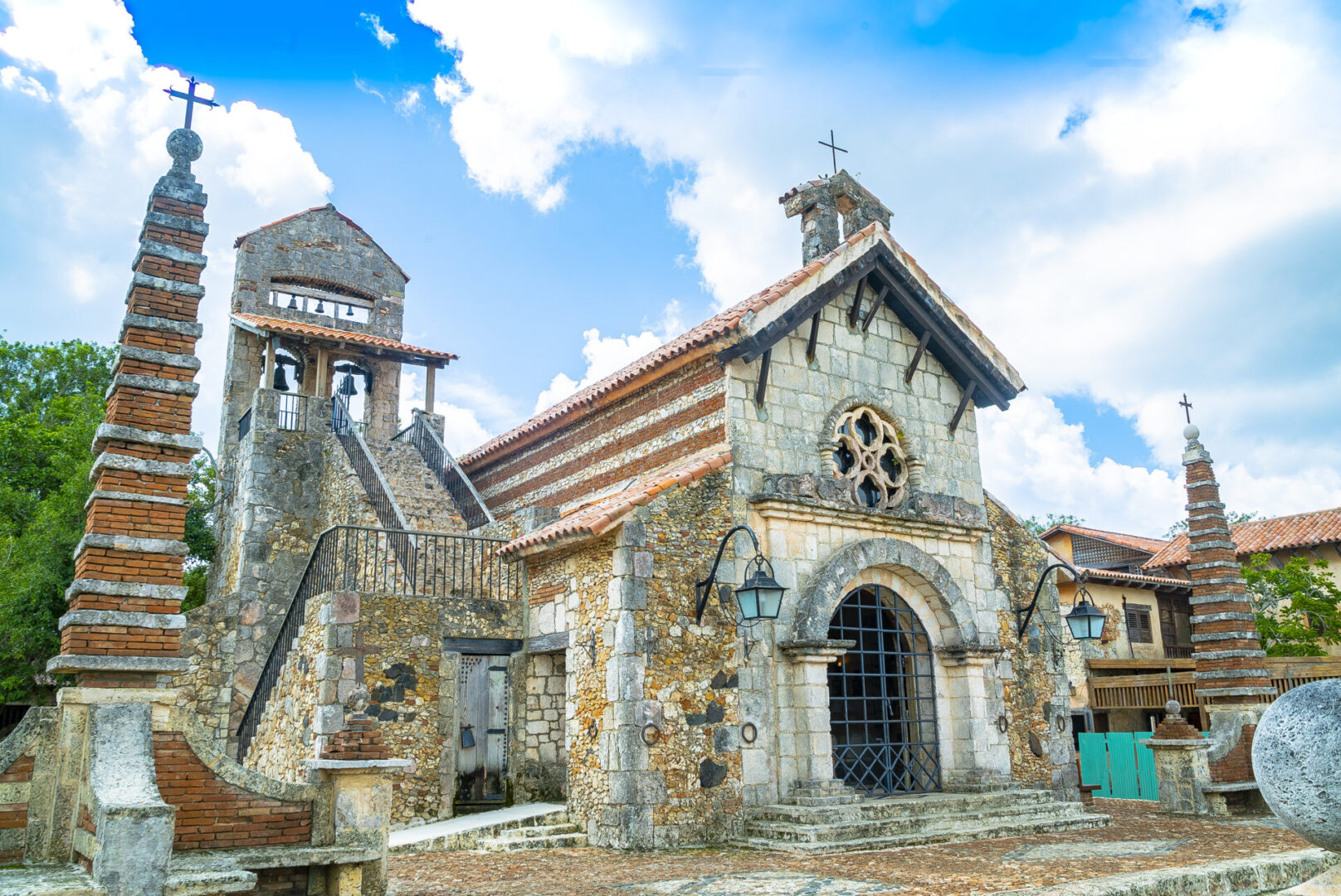 A church with a clock tower in the background.