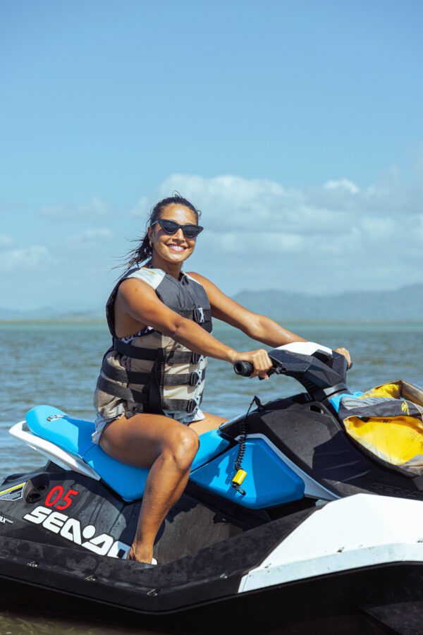 A woman on a jet ski in the ocean.