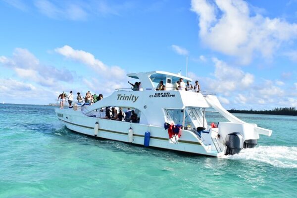 A boat with people on it in the ocean.