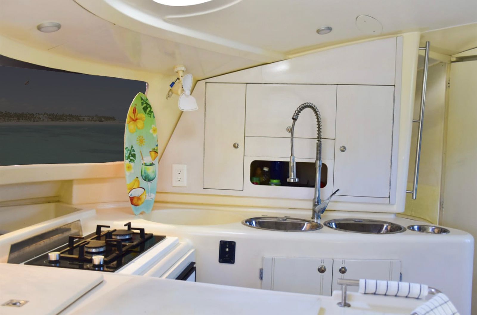 A kitchen with white cabinets and a sink.