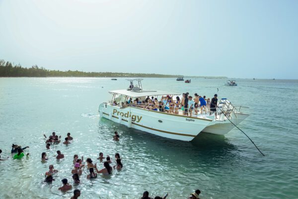 A boat with people on it in the water.