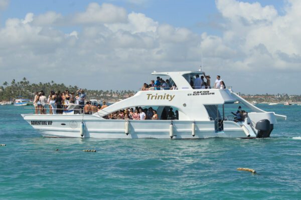 A boat with people on it in the water.